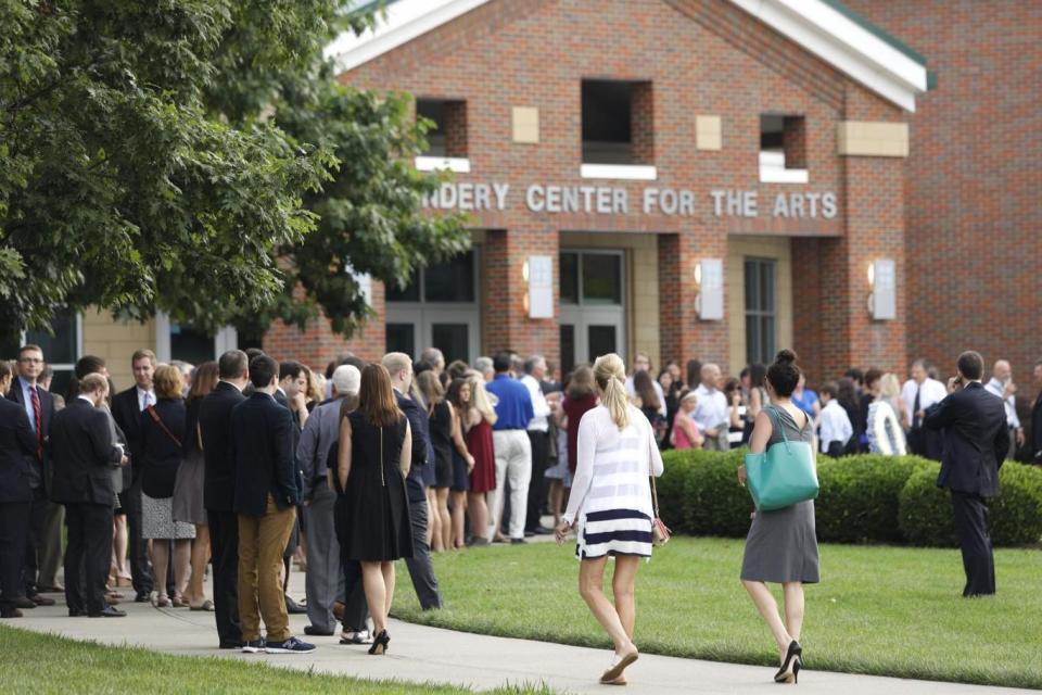 People arrive at Wyoming High School (Getty Images)