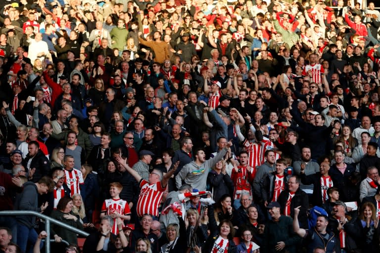 Southampton fans celebrate Harry Arter's missed penalty kick during their match against and Bournemouth in Southampton, southern England on April 1, 2017