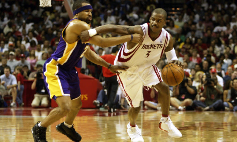 Steve Francis #3 of the Houston Rockets drives around Derek Fisher #2 of the Los Angeles Lakers
