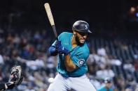 Seattle Mariners' Abraham Toro is hit by a pitch from Arizona Diamondbacks starter Madison Bumgarner during the first inning of a baseball game Friday, Sept. 3, 2021, in Phoenix. (AP Photo/Ross D. Franklin)