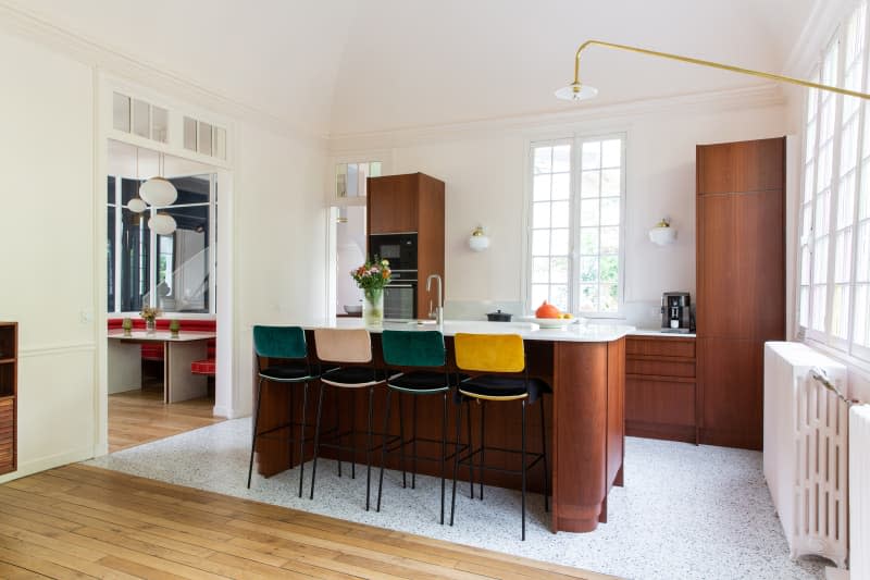 Colorful bar stools in newly renovated kitchen.