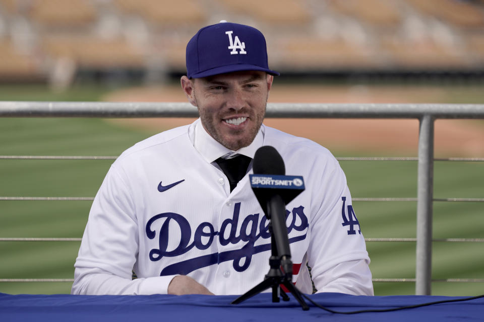 Los Angeles Dodgers' Freddie Freeman speaks during an introductory news conference at spring training baseball, Friday, March 18, 2022, in Glendale, Ariz. (AP Photo/Charlie Riedel)