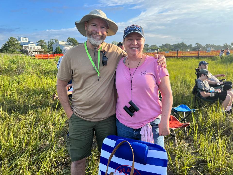 Jason Graves, 47, and  Donna Graves, 52, from Virginia Beach get settled in to welcome the ponies across the Assateague Channel.