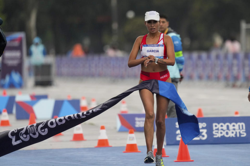 Peru's Gabriela Kimberly Garcia finishing first in the women's 20km race walk final at the Pan American Games in Santiago, Chile, Sunday, Oct. 29, 2023. (AP Photo/Moises Castillo)