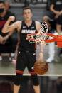 Miami Heat forward Duncan Robinson, rear, reacts as his three-point shot goes in during the second half of an NBA basketball game against the Dallas Mavericks, Tuesday, May 4, 2021, in Miami. (AP Photo/Wilfredo Lee)