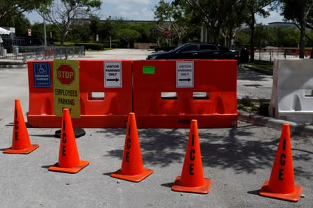 Orange traffic cones with the word "ICE" are seen at Immigration and Customs Enforcement (ICE) facilities, as communities brace for a reported wave of deportation raids across the U.S. by ICE officers, in Miramar near Miami