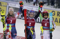 United States' Mikaela Shiffrin, center, winner of an alpine ski World Cup women's slalom race, celebrates with second-placed Croatia's Leona Popovic, left, and third-placed Germany's Lena Duerr, in Levi, Finland, Sunday, Nov. 12, 2023. (AP Photo/Giovanni Auletta)