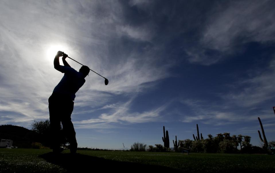 Patrick Reed watches his tee shot on the 17th hole during a practice round for the Match Play Championship golf tournament on Tuesday, Feb. 18, 2014 in Marana, Ariz. (AP Photo/Chris Carlson)