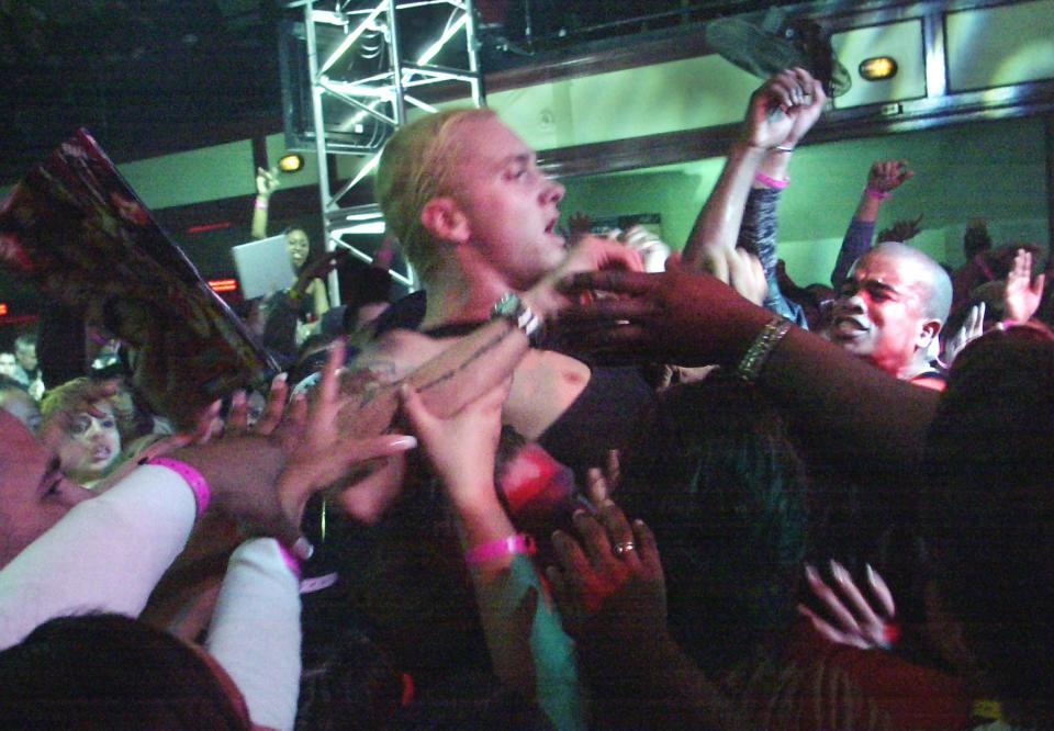 Eminem is held up by the crowd during his performance with D12 at St. Andrews Hall in Detroit on March 13, 2003. The rap superstar was on hand for a party commemorating the DVD release of his film "8 Mile." He and D12, a Detroit-based rap group of which Eminem is a sometime member, finished the song "Rap Game" from the film's best-selling soundtrack.