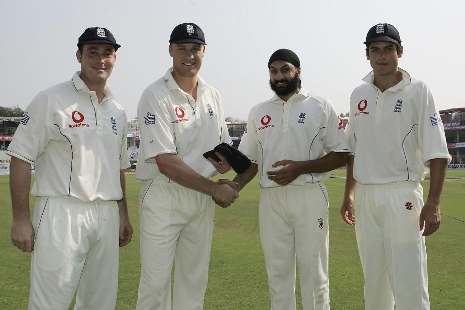 <p>Cook made his debut in England’s first Test of the 2006 tour to India. Pictured here receiving his cap alongside Monty Panesar (second right) and Ian Blackwell (left) after a last minute dash from the Caribbean to Nagpur (Getty Images) </p>