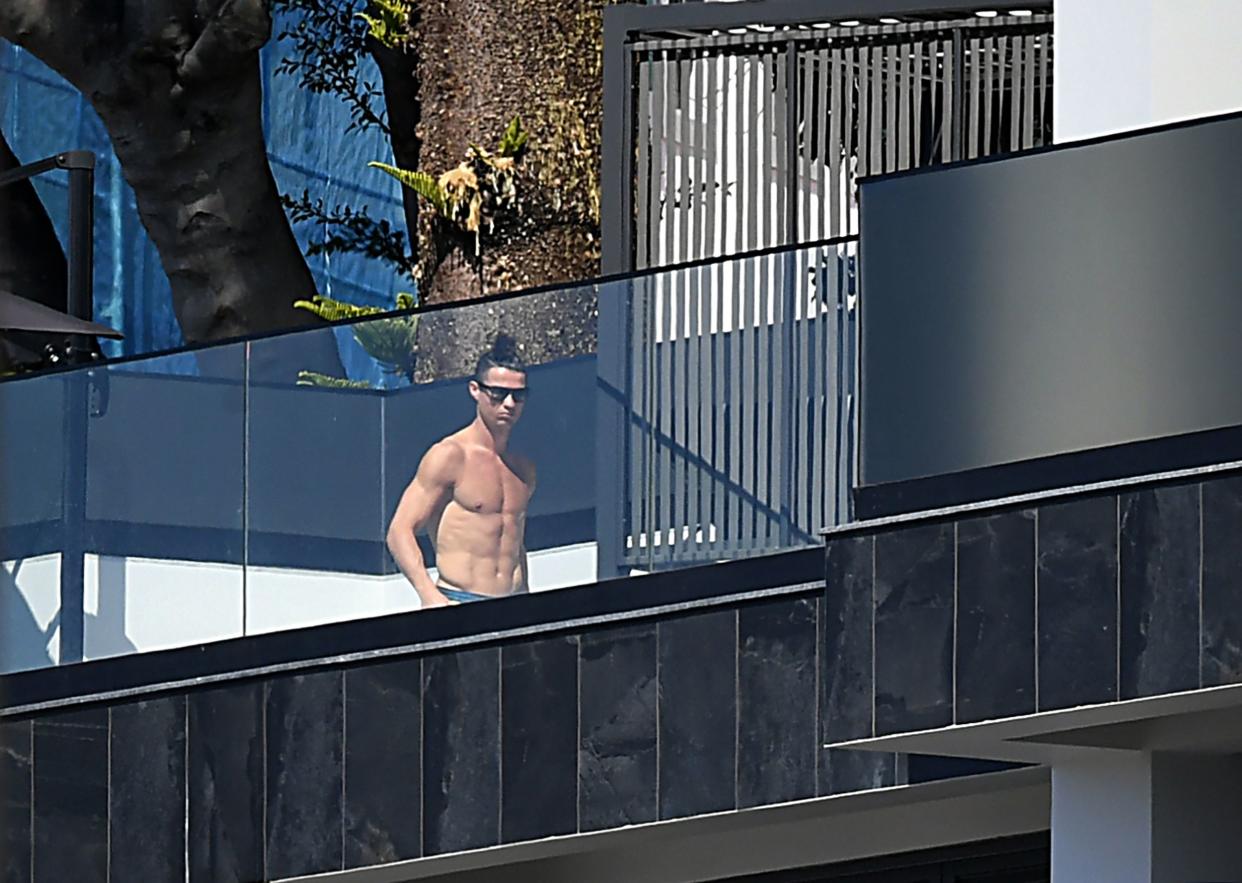 Portugal and Juventus' Portuguese forward Cristiano Ronaldo sunbathes at his home in Funchal on March 16, 2020.