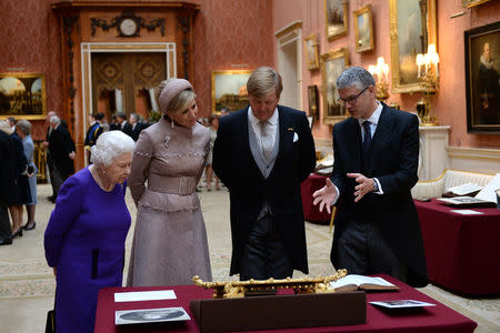 Britain's Queen Elizabeth, accompanies King Willem-Alexander and Queen Maxima of the Netherlands as they view Dutch items from the Royal Collection, during a state visit, at Buckingham Palace in London, Britain October 23, 2018. Chris J Ratcliffe/Pool via REUTERS