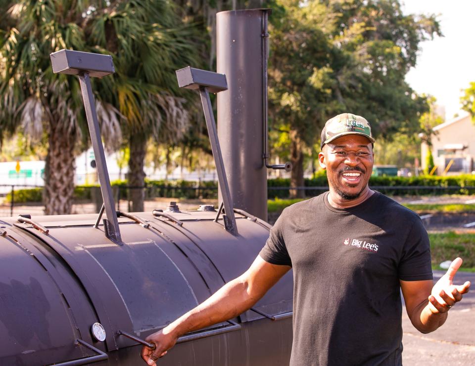 Local barbecue chef and pit master Rashad Jones stands next to a smoker built by his friend Ferdinand Graham, who encouraged him to start his barbecue business. Jones is a contestant in the Food Network's "BBQ BRAWL!" show.  Jones, who owns Big Lee's - Serious About Barbecue, talked about his experience at his Northeast First Avenue location in midtown Ocala on May 18. The episodes air on the Food Network on Monday nights. "I don't need fame. I just want to be Rashad. I have a responsibility to represent the community, my craft and culture," Jones said.