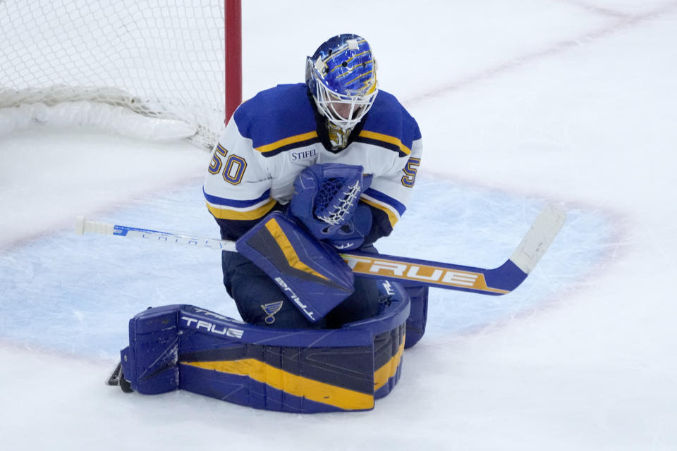 St. Louis Blues goaltender Jordan Binnington makes a chest save during the first period of an NHL hockey game against the Chicago Blackhawks Wednesday, Nov. 16, 2022, in Chicago. (AP Photo/Charles Rex Arbogast)