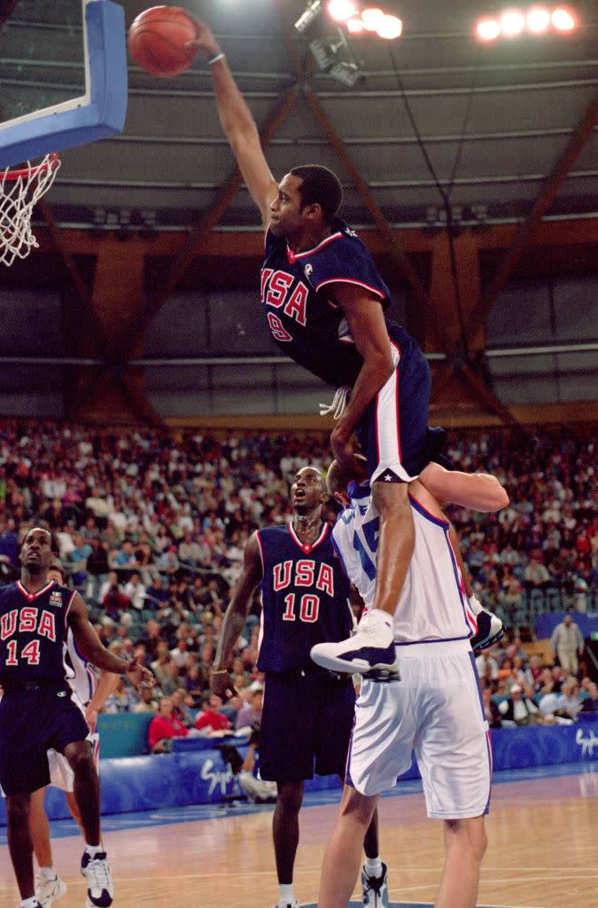 25 Sep 2000:  Vince Carter of the USA leaps over Frederic Weis of France to dunk during the Mens Basketball Preliminaries at the Dome in the Olympic Park on Day 10 of the Sydney 2000 Olympic Games in Sydney, Australia.  Mandatory Credit: Darren McNamara/Allsport