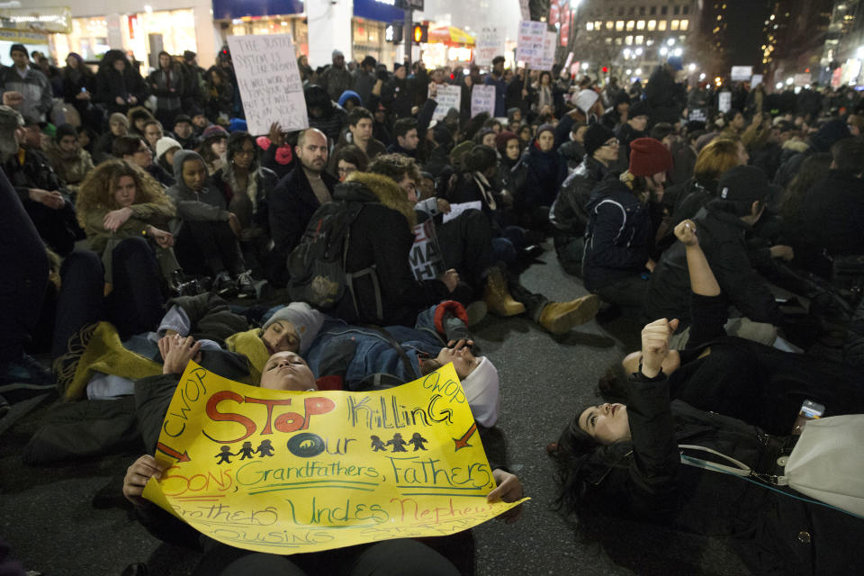 Protestors occupy Herald Square during march Thursday, Dec. 4, 2014, in New York, against a grand jury's decision not to indict the police officer involved in the death of Eric Garner. A grand jury cleared a white New York City police officer Wednesday in the videotaped chokehold death of Garner, an unarmed black man, who had been stopped on suspicion of selling loose, untaxed cigarettes, a lawyer for the victim's family said. (AP Photo/John Minchillo)