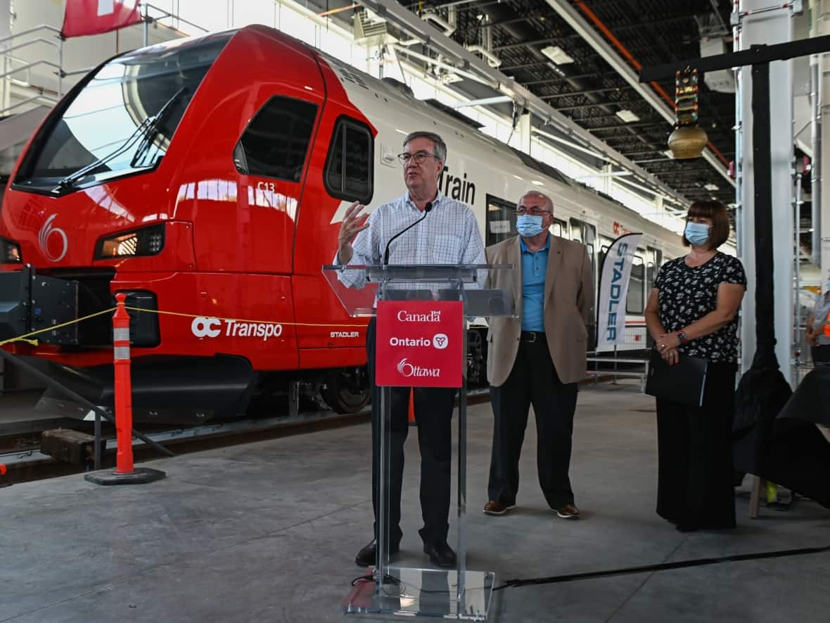 Ottawa Mayor Jim Watson delivers remarks at an event unveiling the new Stadler FLIRT train system for the city's Trillium Line at Walkley Yard in Ottawa July 15, 2022.  (Spencer Colby/The Canadian Press - image credit)