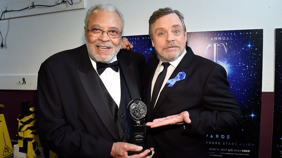 James Earl Jones and Mark Hamill pose with a trophy backstage at the Tony Awards.