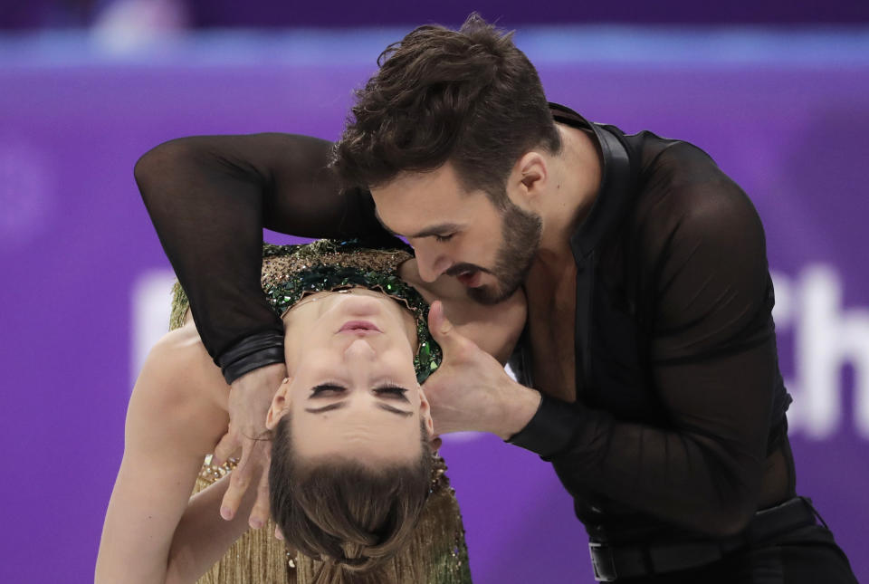 <p>Gabriella Papadakis and Guillaume Cizeron of France perform during the ice dance, short dance figure skating in the Gangneung Ice Arena at the 2018 Winter Olympics in Gangneung, South Korea, Monday, Feb. 19, 2018. (AP Photo/Julie Jacobson) </p>