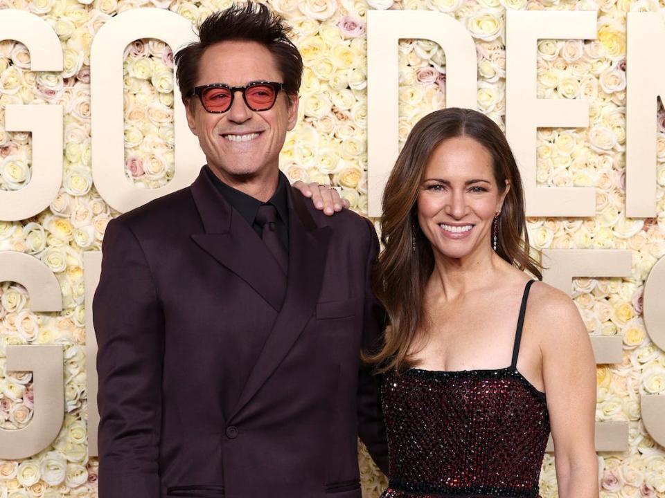 Robert Downey Jr. and Susan Downey attend the 2024 Golden Globes.