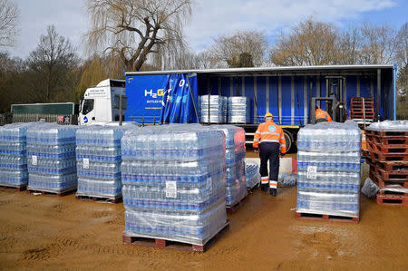 Thames Water operatives collect bottled water for distribution in Hampstead in London, Britain, March 5, 2018. REUTERS/Toby Melville
