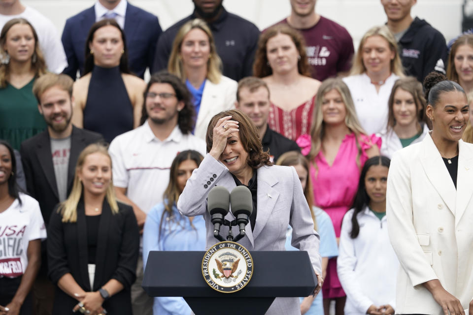 Vice President Kamala Harris speaks as the women's and men's NCAA Champion teams from the 2022-2023 season are celebrated during College Athlete Day on the South Lawn of the White House, Monday, June 12, 2023. Logan Eggleston, member of the University of Texas at Austin's NCAA national championship-winning college volleyball team stands at right.(AP Photo/Andrew Harnik)