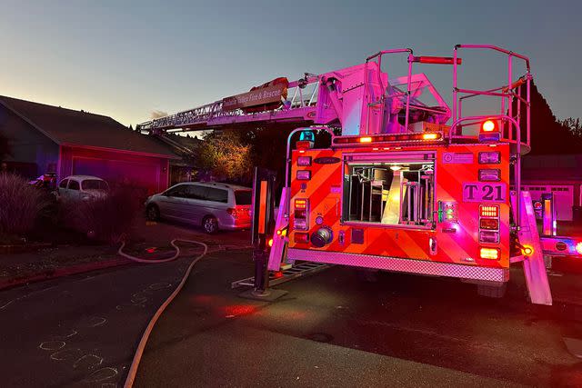 <p>Tualatin Valley Fire and Rescue/Facebook</p> Plane crash site of a home in Oregon that left two dead and one injured on Tuesday evening.