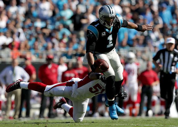 Newton runs away from Kevin Minter in Sunday's game.