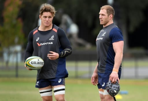 Australian Wallabies' captain Michael Hooper (L) chats with teammate David Pocock during a training session in Melbourne on June 12, 2018, ahead of their second Test match against Ireland