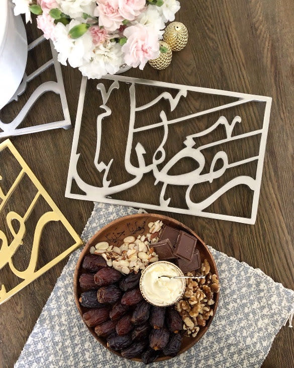 <p><a href="https://www.therustikhome.com/products/ramadan-trivet-arabic-english" rel="nofollow noopener" target="_blank" data-ylk="slk:Shop Now;elm:context_link;itc:0;sec:content-canvas" class="link ">Shop Now</a></p><p>Ramadan Trivet</p><p>therustikhome.com</p><p>$65.00</p><span class="copyright">The Rustik Home</span>