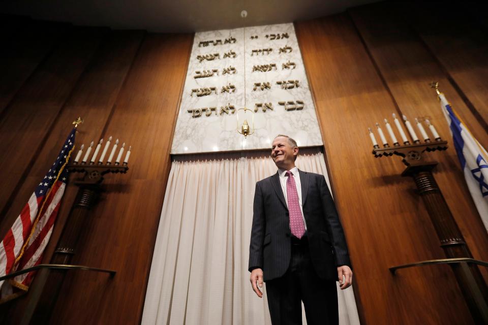 Rabbi Raphael Kanter stands in front of the Ark where the Torah is stored at the Tifereth Israel Synagogue on Brownell Avenue in New Bedford which is celebrating its 100th anniversary.