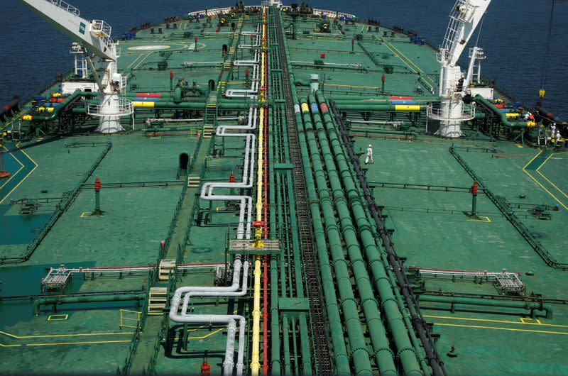 FILE PHOTO: Pipelines run down the deck of Hin Leong's Pu Tuo San VLCC supertanker in the waters off Jurong Island in Singapore