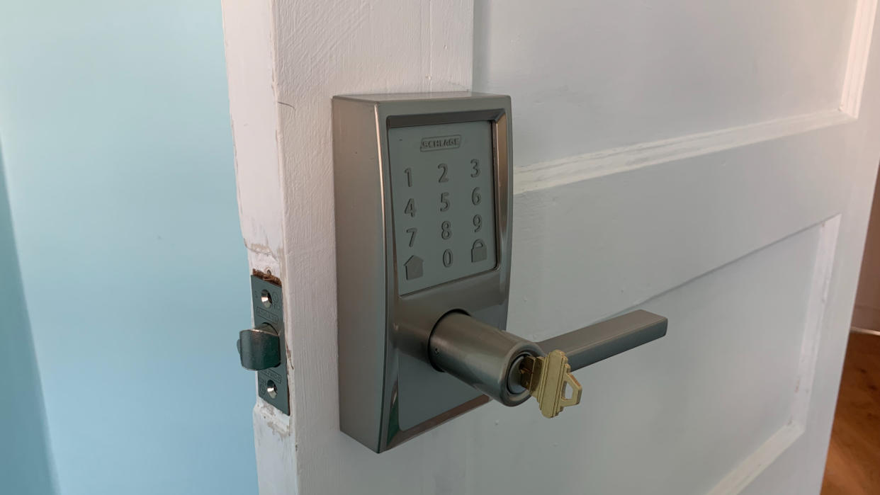  Schlage Encode fitted on a door with a key in the lock 