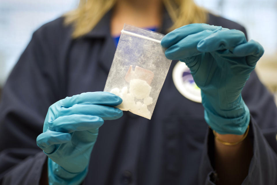 FILE - In this Aug. 9, 2016, file photo, a bag of 4-fluoro isobutyryl fentanyl which was seized in a drug raid is displayed at the Drug Enforcement Administration (DEA) Special Testing and Research Laboratory in Sterling, Va. Acting United States DEA administrator Chuck Rosenberg will visit China next week amid efforts to cut off the Chinese supply of deadly synthetic drugs, like fentanyl. China disputes U.S. claims that it’s the top source of opioids. Still, Beijing has already banned fentanyl, an opioid some 50 times stronger than heroin, and 18 related compounds. (AP Photo/Cliff Owen, File)