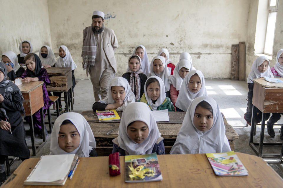 Girls attend class on the first day of the new school year, in Kabul, Afghanistan, on Saturday, March 25, 2023. The new Afghan educational year started, but high school remained closed for girls for the second year after Taliban returned to power in 2021. (AP Photo/Ebrahim Noroozi)