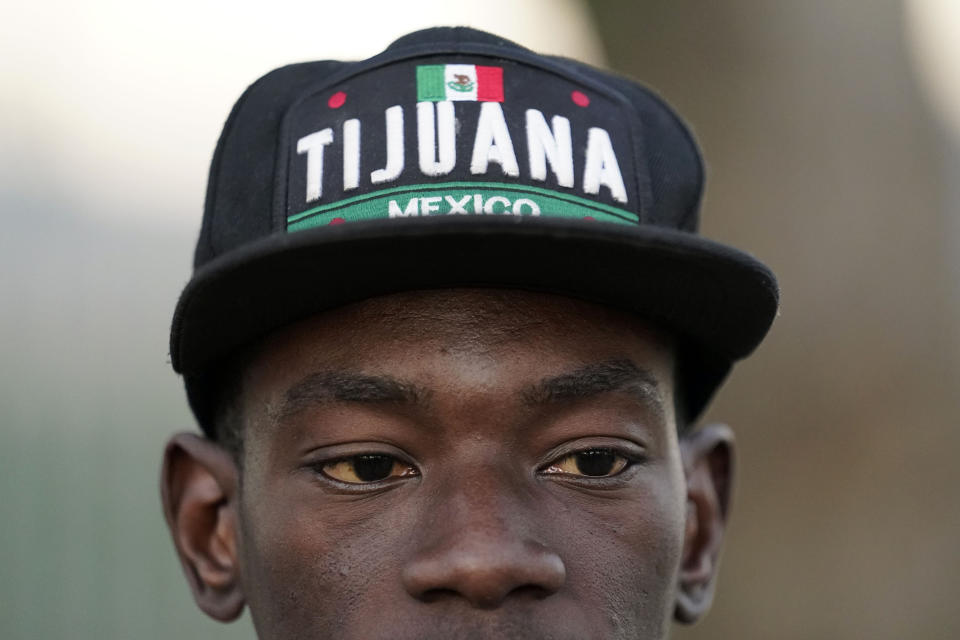 A Haitian migrant waits for his current asylum status at an entry point, Tuesday, Dec. 20, 2022, in Tijuana, Mexico. The U.S. government made its plea in a filing a day after Chief Justice John Roberts issued a temporary order to keep the pandemic-era limits on migrants in place. (AP Photo/Marcio Jose Sanchez)