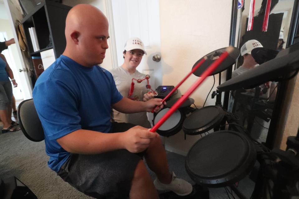 Lance Avery plays drums with friend Rilea Jackson, Tuesday, Sept. 27, 2022, at his Ormond Beach home.