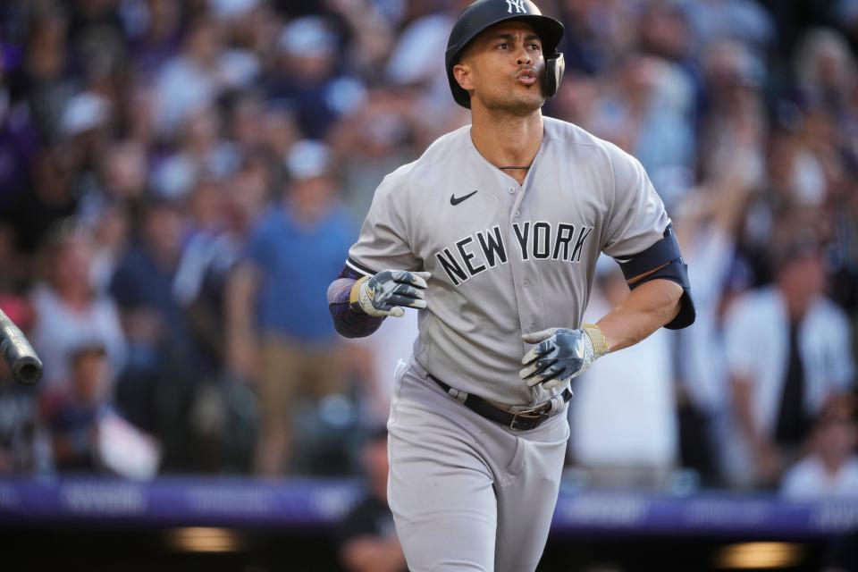 New York Yankees' Giancarlo Stanton flips the bat after hitting a three-run home run off Colorado Rockies starting pitcher Connor Seabold during the second inning of a baseball game Saturday, July 15, 2023, in Denver.(AP Photo/David Zalubowski)