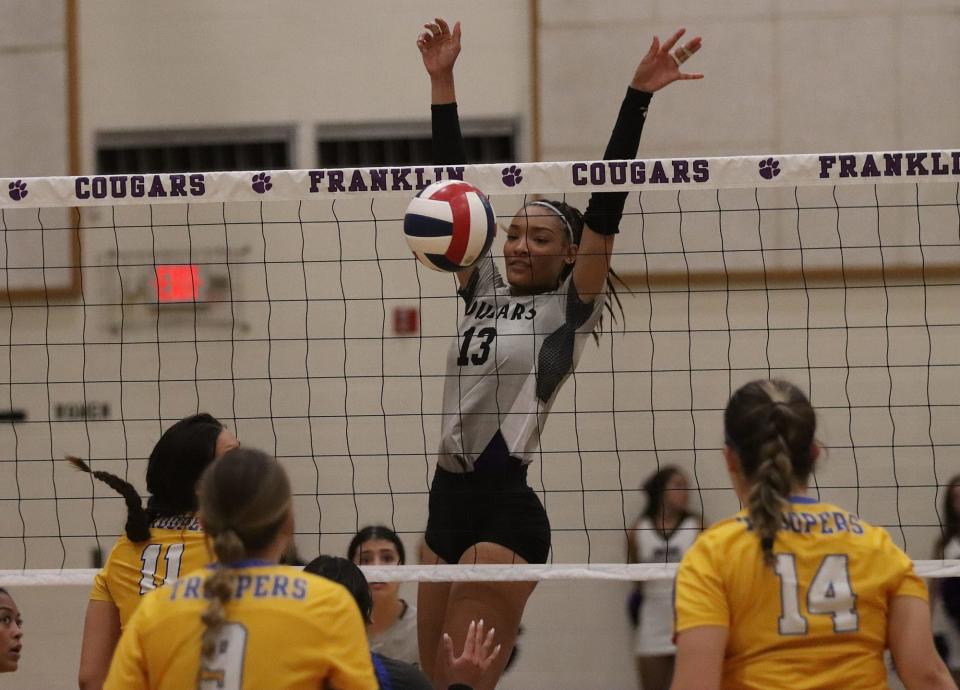 Franklin High SchoolÕs (13) Breannah Peterson in a volleyball game against Eastwood on Tuesday night. 