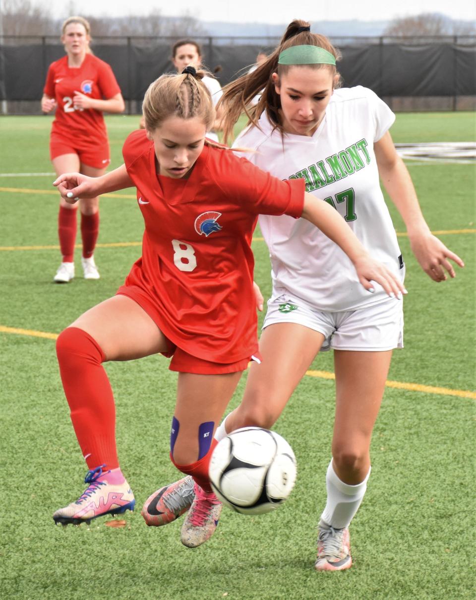 New Hartford's Maddie Truax and Schalmont's Caelyn Eiser (from left) seek control of the ball during the second half of Saturday's Class A regional playoff match at Herkimer College.