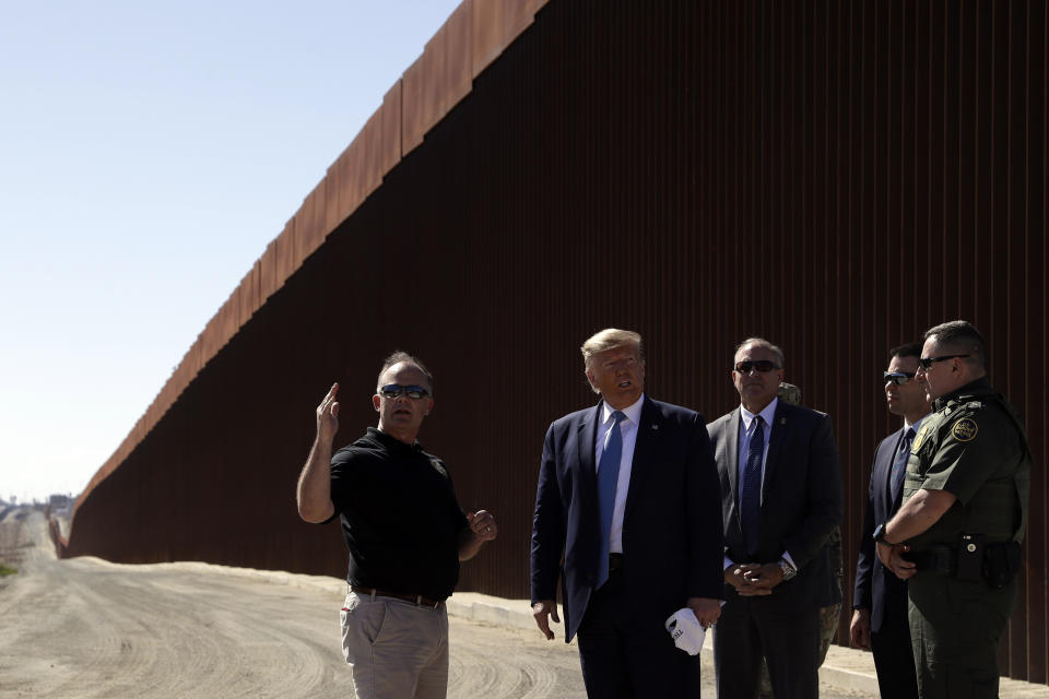 President Donald Trump tours a section of the southern border wall under construction Wednesday, Sept. 18, 2019, in Otay Mesa, Calif. (AP Photo/Evan Vucci)