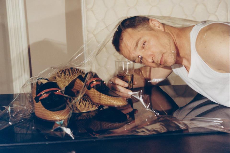 GOODLIFE tank top, £64 (goodlife clothing.com). GUCCI loafers  (on table), £735  (gucci.com) (Sam Rockwell by Cameron Postforoosh for ES Magazine)