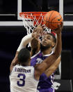 TCU guard Rondel Walker blocks a shot by Kansas State forward David N'Guessan (3) during the first half of an NCAA college basketball game Tuesday, Feb. 7, 2023, in Manhattan, Kan. (AP Photo/Charlie Riedel)