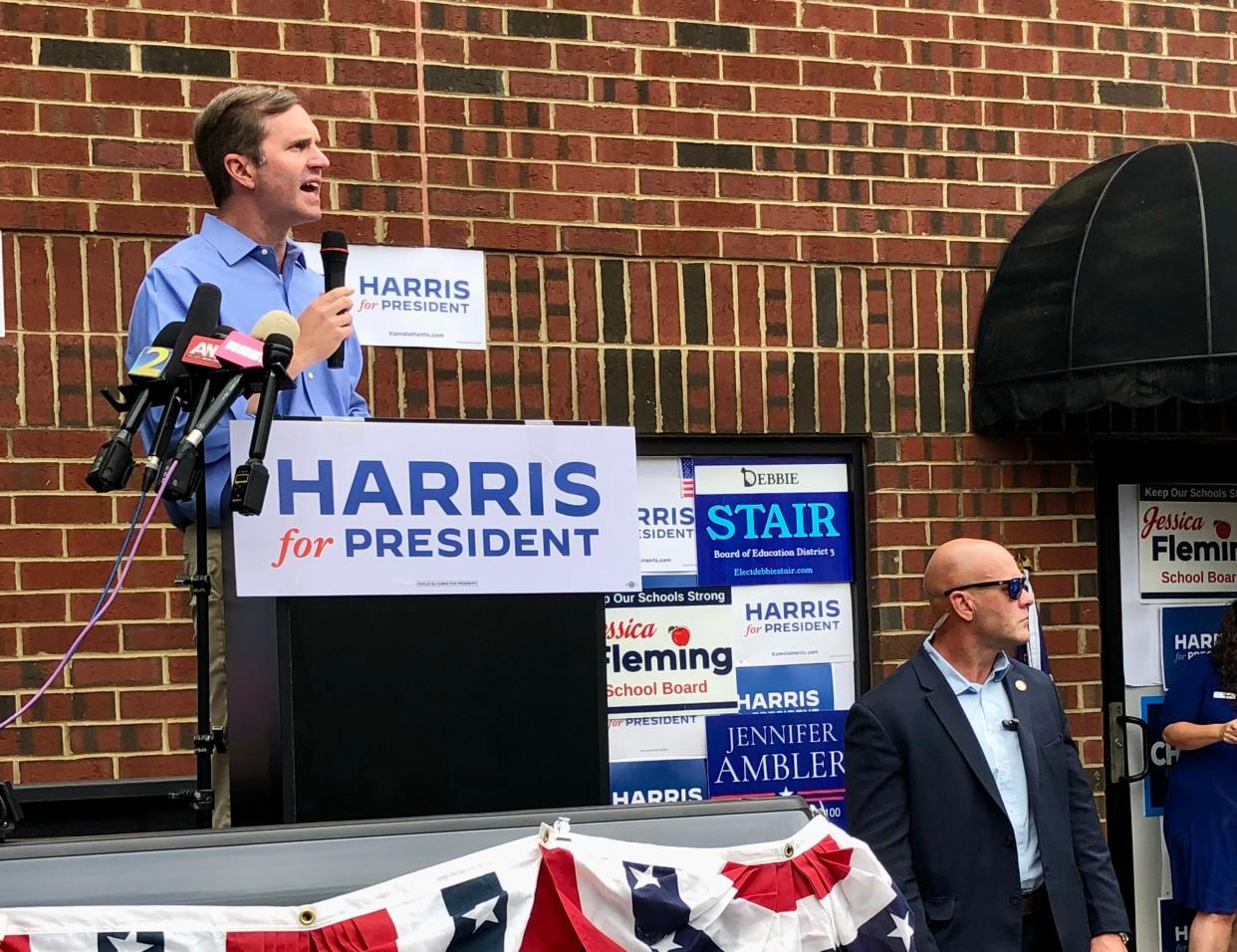 Kentucky Gov. Andy Beshear speaks in front of a crowd in Forsyth County, Georgia on behalf of Vice President Kamala Harris' presidential campaign.