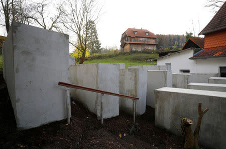 A pared-down version of Berlin's Holocaust memorial built by a German political art group, is seen next to the home (background) of Bjoern Hoecke, a senior member of the anti-immigrant Alternative for Germany (AFD), in the village of Bornhagen, Germany, November 22, 2017. REUTERS/Kai Pfaffenbach
