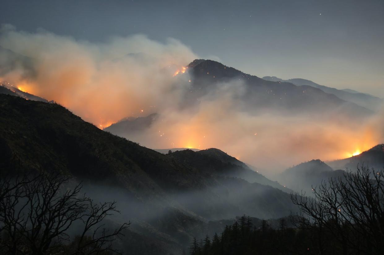 <span class="caption">Heat and dryness are leaving high mountain areas more vulnerable to forest fires.</span> <span class="attribution"><a class="link " href="https://www.gettyimages.com/detail/news-photo/the-241-square-mile-station-fire-continues-to-blacken-news-photo/90351732" rel="nofollow noopener" target="_blank" data-ylk="slk:David McNew/Getty Images;elm:context_link;itc:0;sec:content-canvas"> David McNew/Getty Images</a></span>