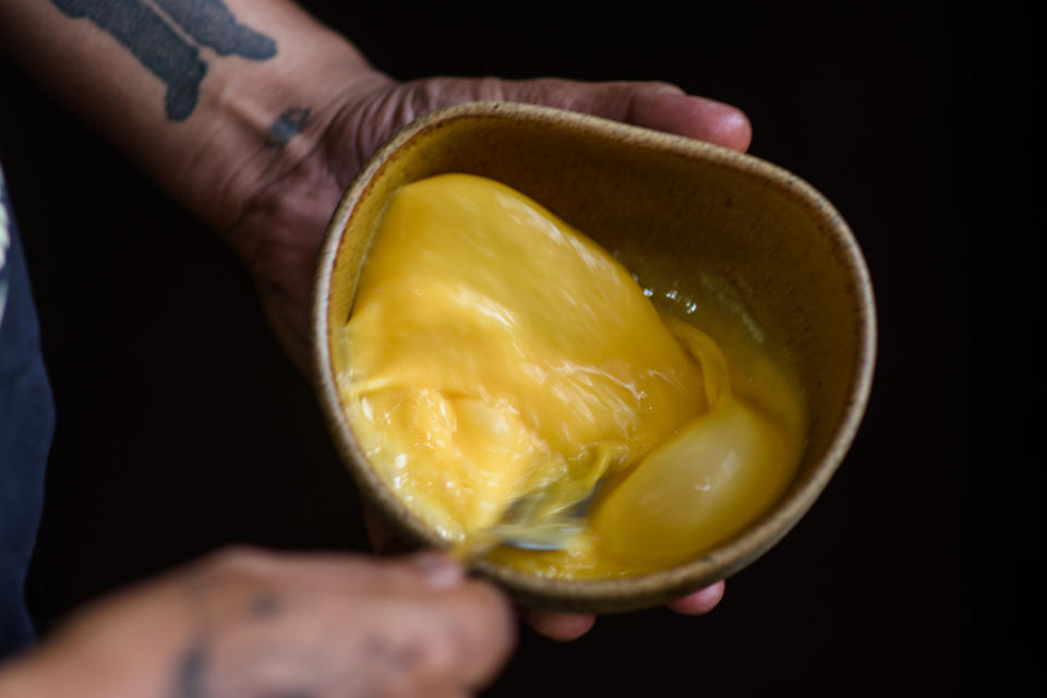 eggs being beaten in a bowl