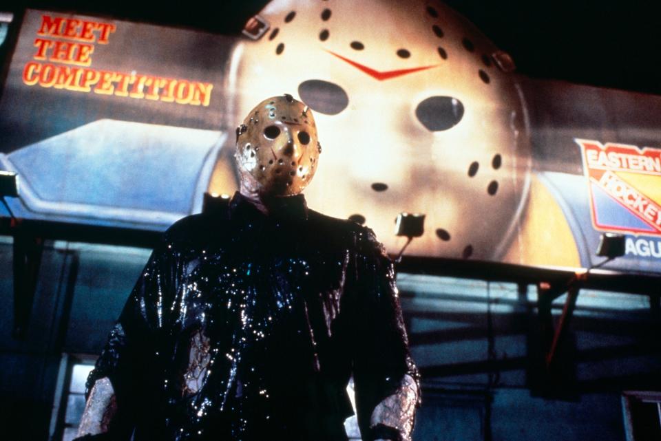 Jason Voorhees stands in front of a hockey billboard in New York City in "Friday the 13th, Part VIII: Jason Takes Manhattan"