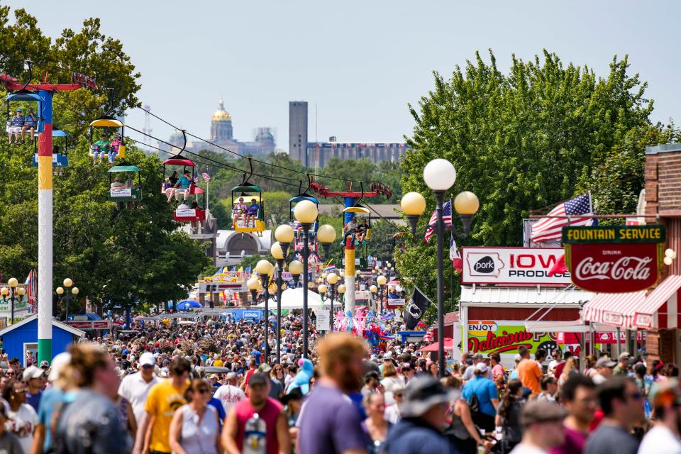 Thousands of people walk the concourse during the Iowa State Fair in Des Moines.