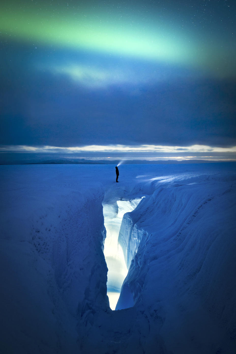 Ice crevasse and aurora, Greenland. (Photo: Paul Zizka/Caters News)